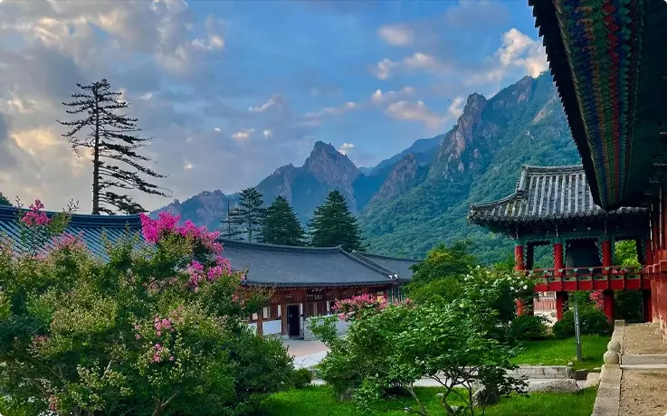 View of a pavilion in Seoraksan National Park with seasonal flowers in bloom