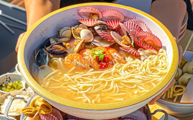 Yonggung Seafood Kalguksu served in a bowl