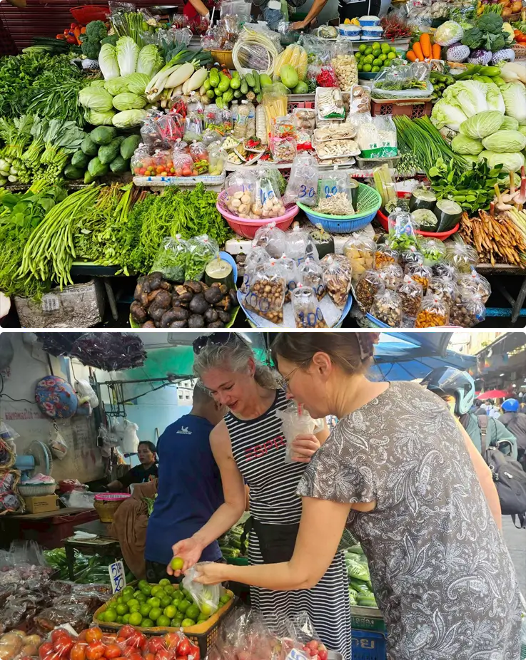 Visitors shopping for ingredients at Huai Khwang Market for the Thai cooking class