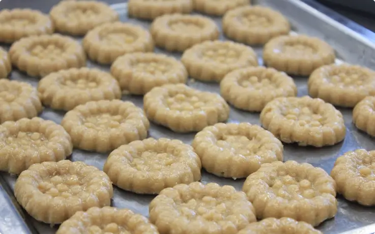 Yakgwa dough shaped in a round flower-like shape
