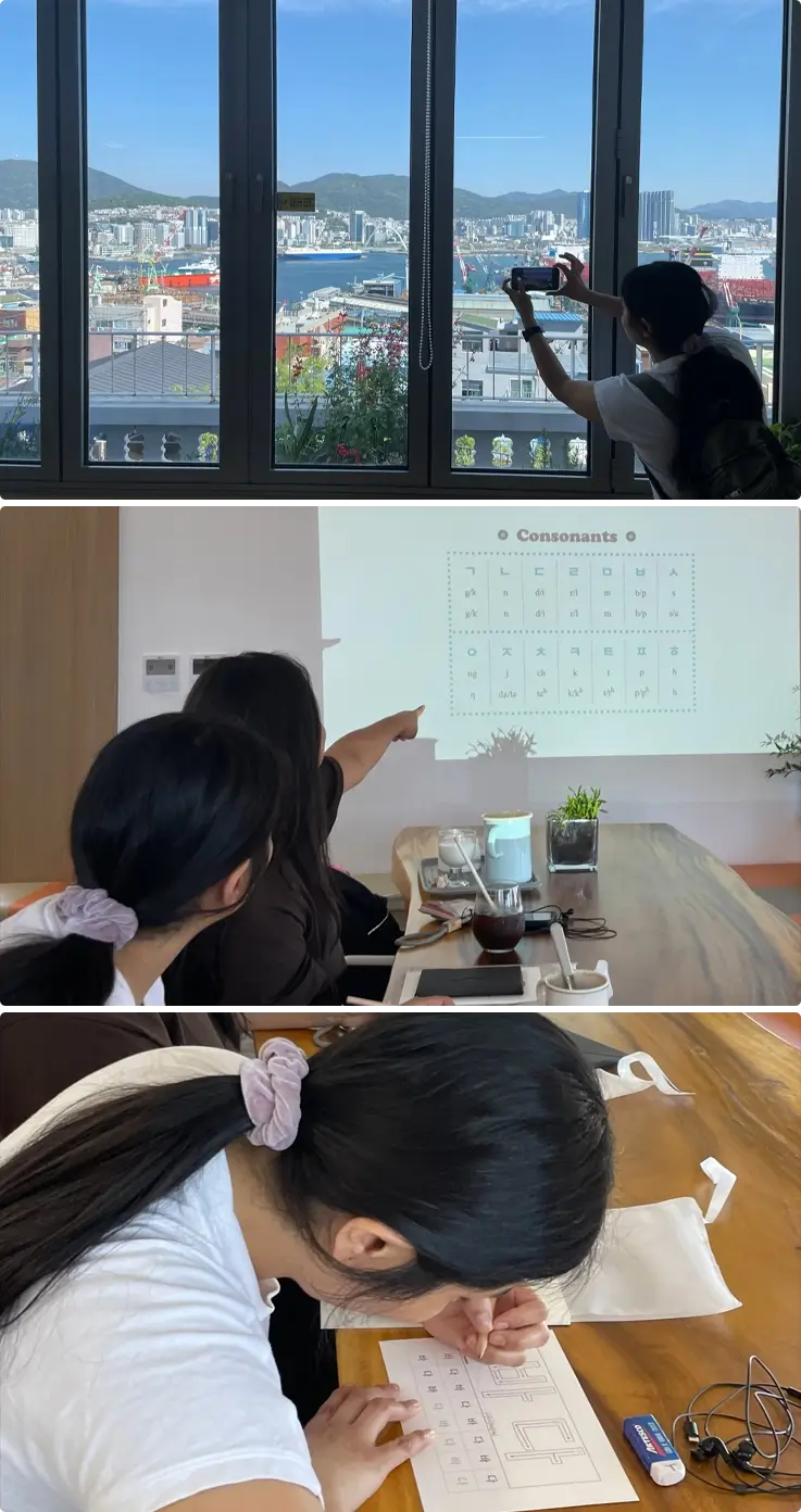 Visitors at Bongsan Village learning how to write basic Korean at a cafe
