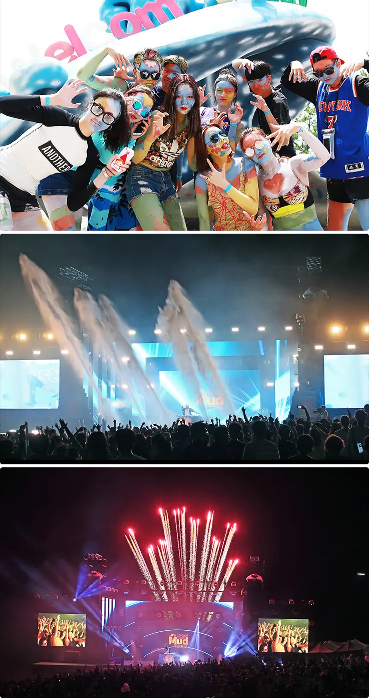 Nighttime mud festival concert stage with fireworks, lights, and cheering crowds.