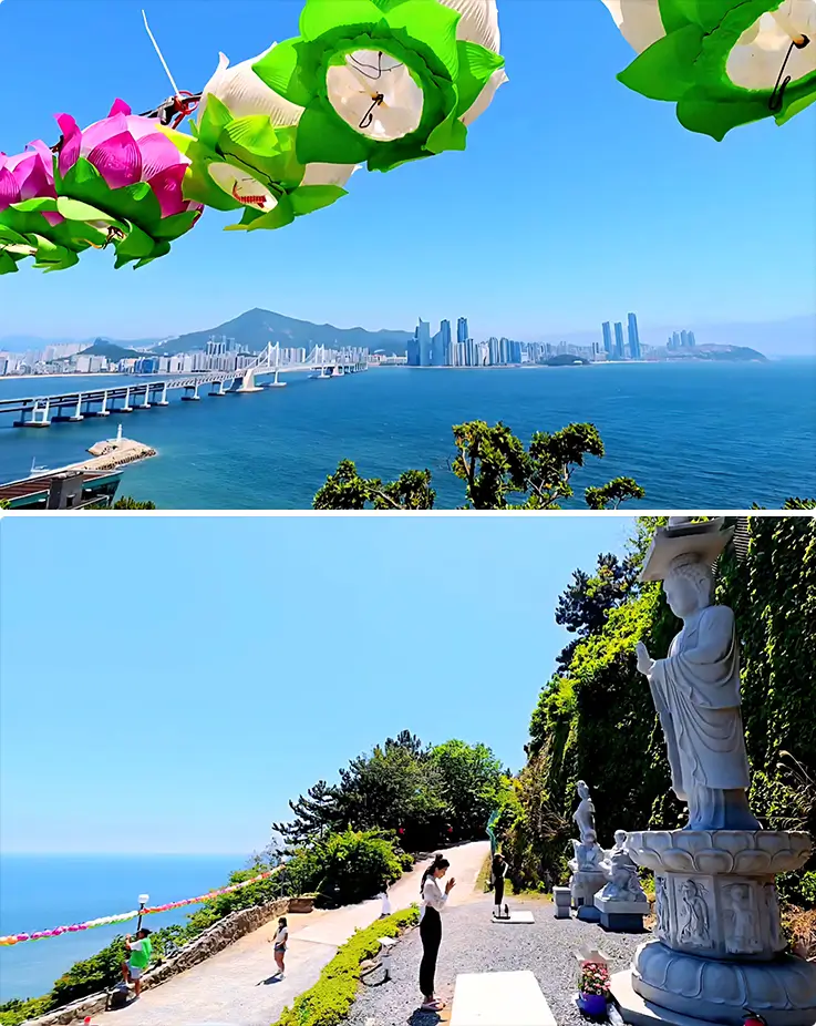 Colorful lotus lanterns frame a stunning panoramic view of Gwangan Bridge and Busan's skyline from a hilltop temple with Buddha statues.