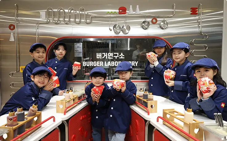 Children enjoying burger making experience at KidZania Busan