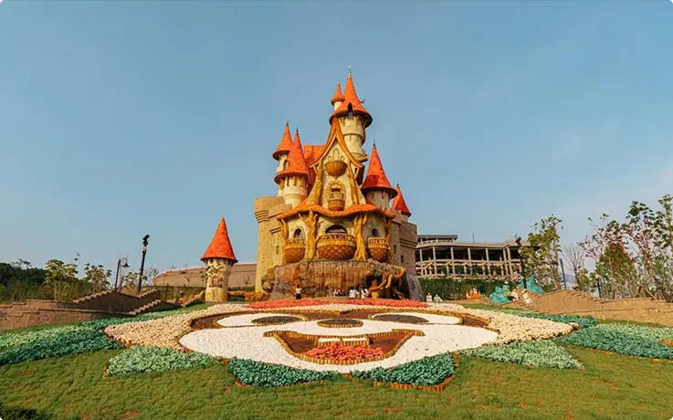 Whimsical fairy-tale theme park featuring enchanting castle scenery and vibrant floral landscapes.