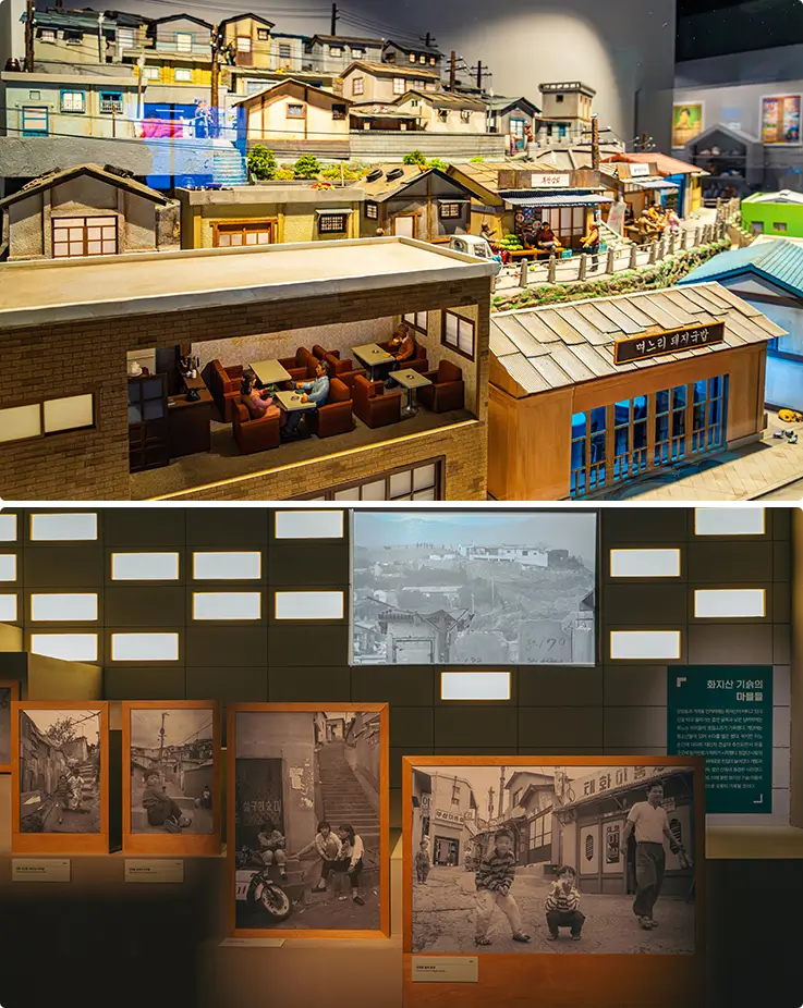 Busan Modern History Museum hillside village diorama and vintage black-and-white photo exhibits.