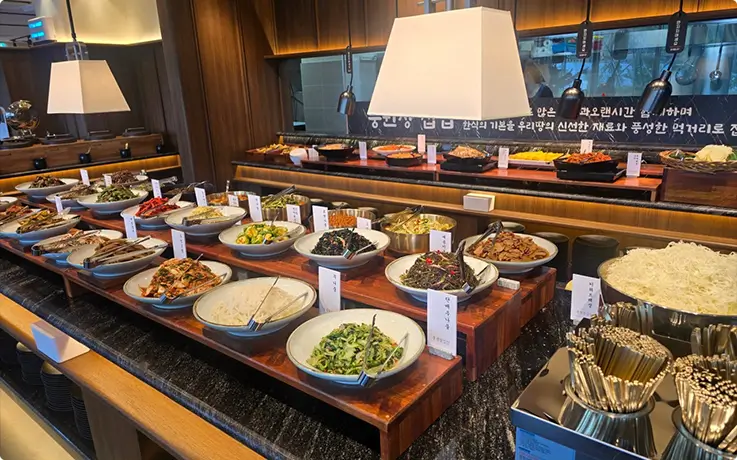 Generous Korean home-style buffet showcasing authentic traditional dishes and handcrafted side dishes.