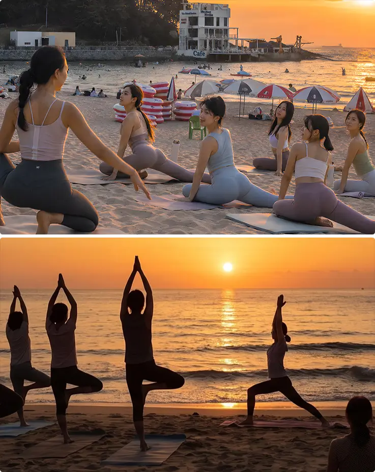Group sunset yoga session on Songjeong Beach with ocean views.