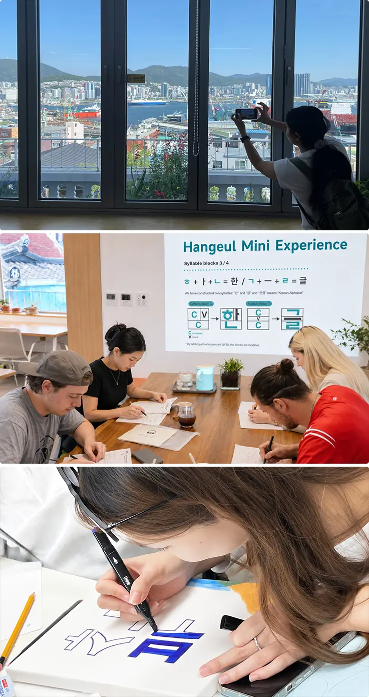 Visitors at Bongsan Village learning how to write basic Korean at a cafe.