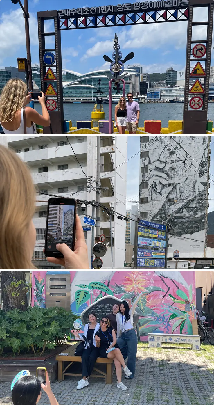 Travelers explore colorful murals and historic landmarks throughout Yeongdo's creative art village.