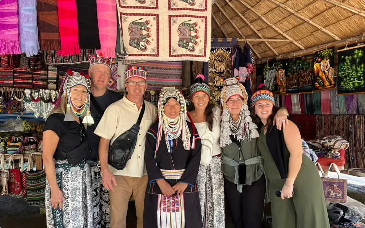 Tourists posing for a picture with the Long Neck Karen Tribe