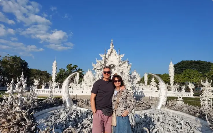 People standing in front of White Temple in Chiang Rai