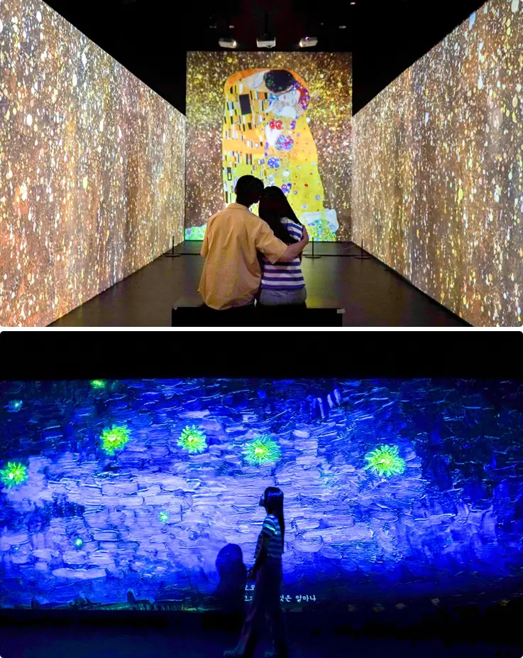 People enjoying an immersive media art exhibition at the Muse Museum in Gangneung