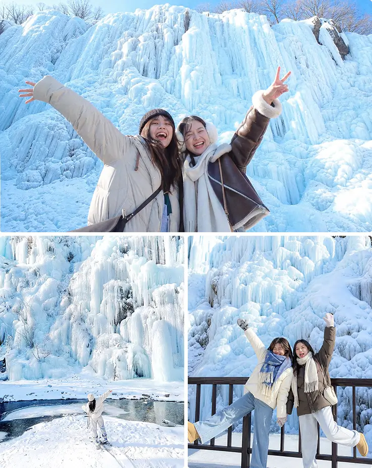 Travelers posing at Korea's giant frozen waterfall with icicles in winter.