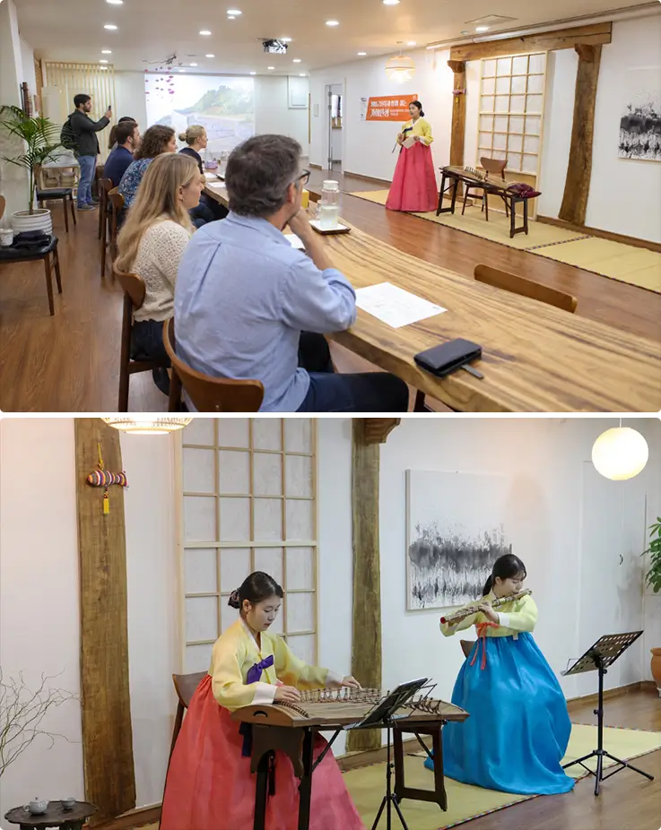 Traditional hanbok performers play gayageum and daegeum for international guests at Yedarm.