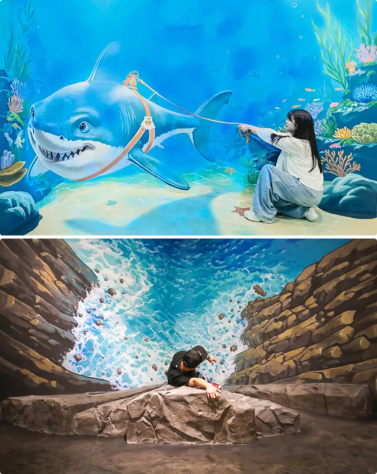Ocean Island trick art zone showcasing a vivid underwater shark mural and dramatic Jeju coastal rock scenery.