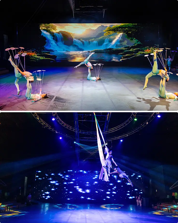 Acrobats balancing plates on sticks and performer suspended in midair during an aerial silk routine at the Jeju Art Circus Show