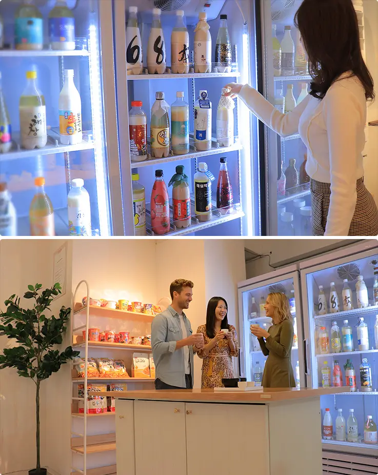 People enjoying premium makgeolli labels and other Korean spirits at White Moon Gallery in Myeongdong