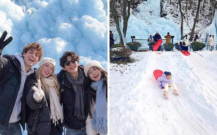 韓国の凍った滝を訪れた友人たちと、雪の坂をそりで滑る子ども