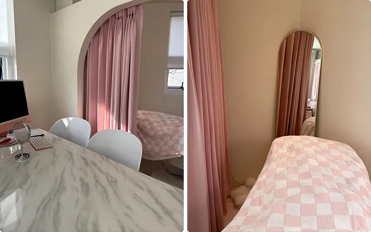 Private treatment room with soft pink curtains and comfortable bed.