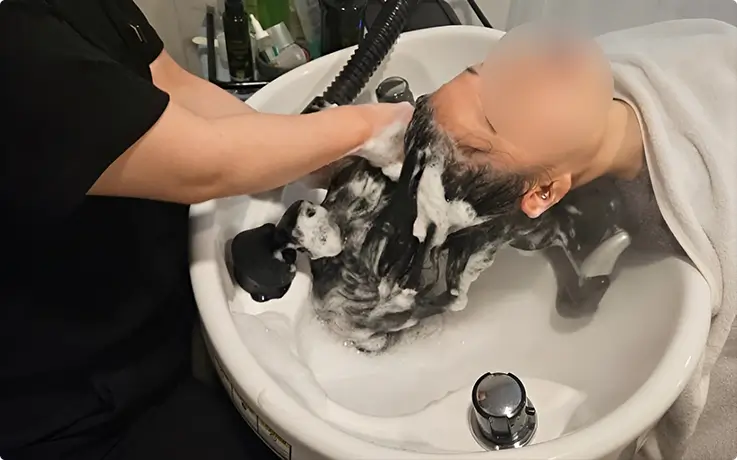A person getting premium scalp clinic service at Dressmun in Seoul