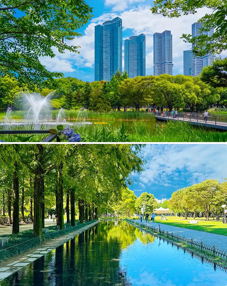 Lush green parkland with fountains, tree-lined paths, and modern skyline views.