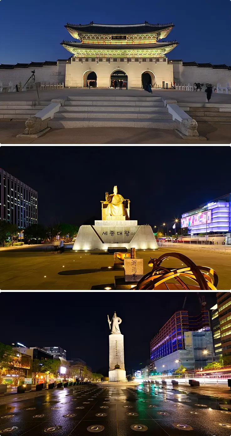 Statues of King Sejong, Admiral Yi Sun-Sin, and Gwanghwamun Gate at the square at night in Seoul