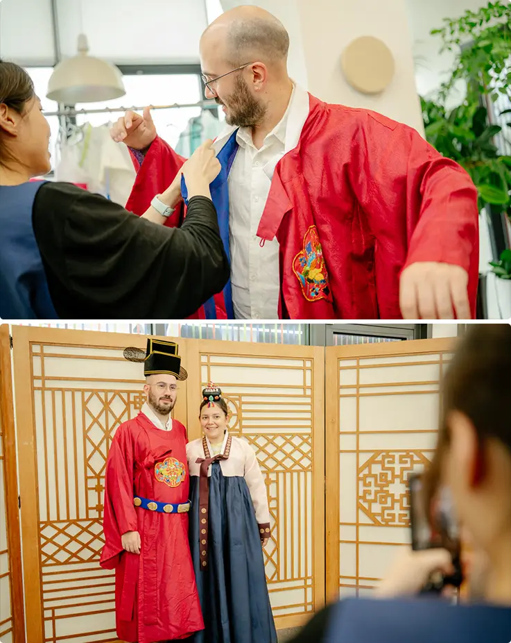 Tamu mencoba hanbok yang berwarna-warni untuk momen foto gaya istana kerajaan.