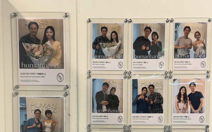 Humanhandz wall of photos with influencers and creators who visited the studio.
