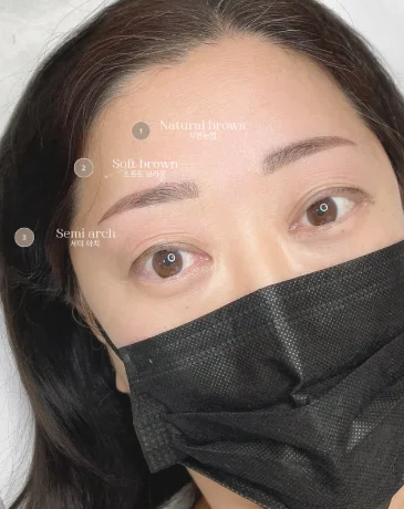 Customized Korean eyebrow PMU design featuring soft brown brows with semi-arch shape.