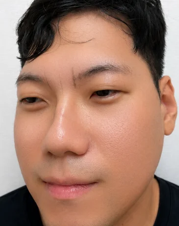 Before men’s eyebrow PMU showing sparse, faint brows with an uneven shape.