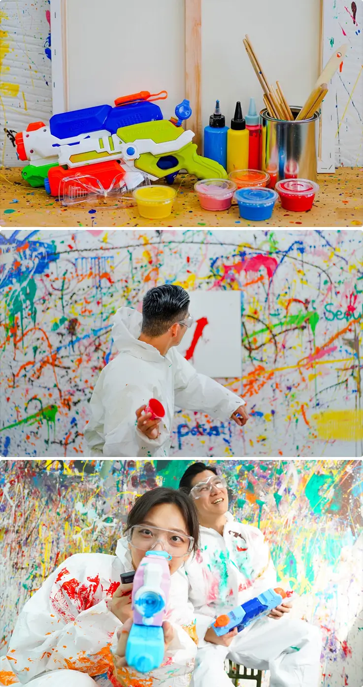 Painting tools, colorful paint cups, and joyful couple splatter artwork together.