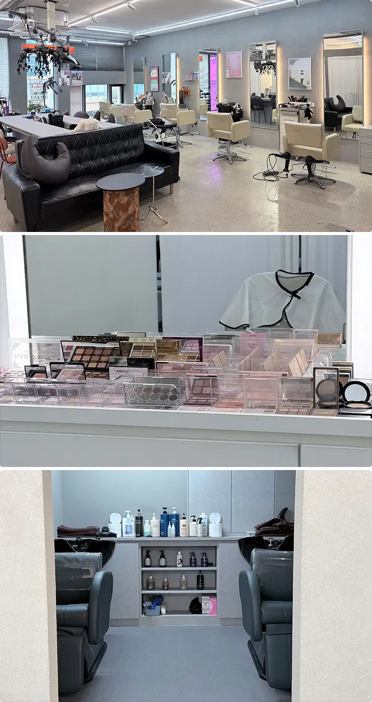Spacious K-beauty salon interior with professional styling stations, premium makeup display, and dedicated shampoo area.