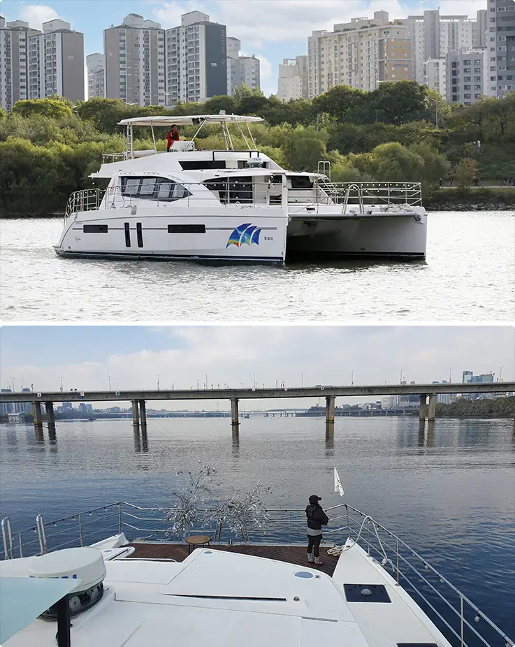Premium 48-passenger catamaran Rozalin moored on the Han River with a spacious open deck offering panoramic riverside views.