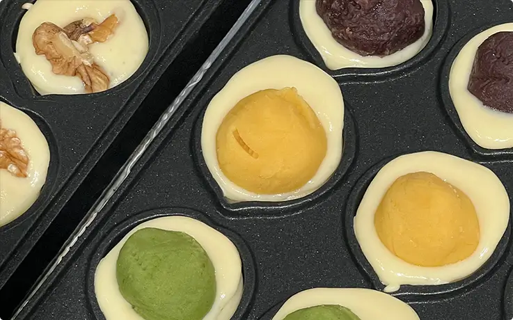 The batter and fillings of the walnut cake in a mold at Tiki Room in Seoul