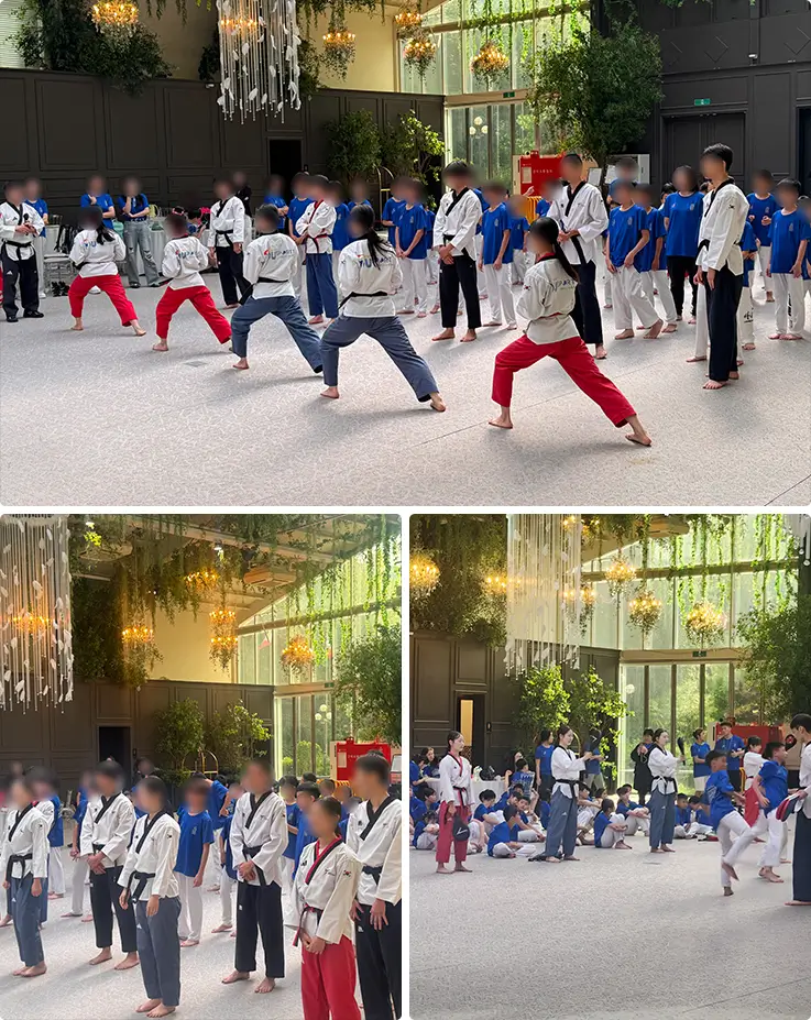 Participants learn taekwondo stances from instructors in a bright hall.