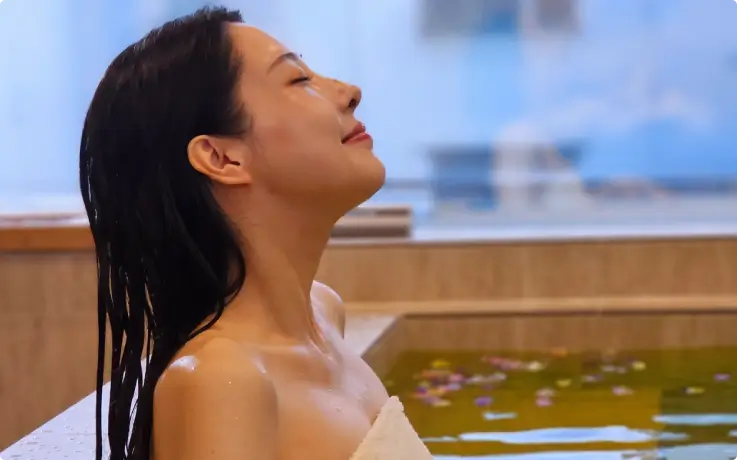 Guest soaking in a warm bath