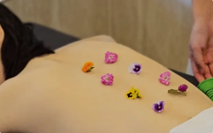 Flower petals placed on the guest's back