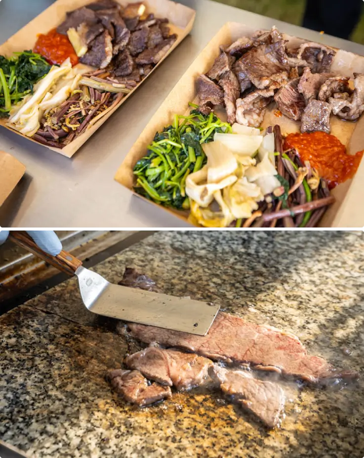 Close-up of sizzling Korean barbecue with side dishes