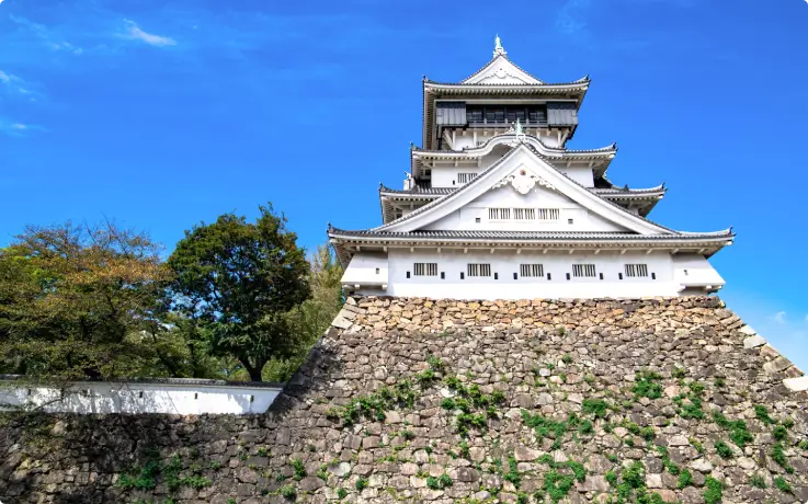 Kokura Castle with traditional Japanese architecture and surrounding gardens