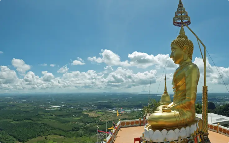Tiger Cave Temple with golden Buddha statue and panoramic view