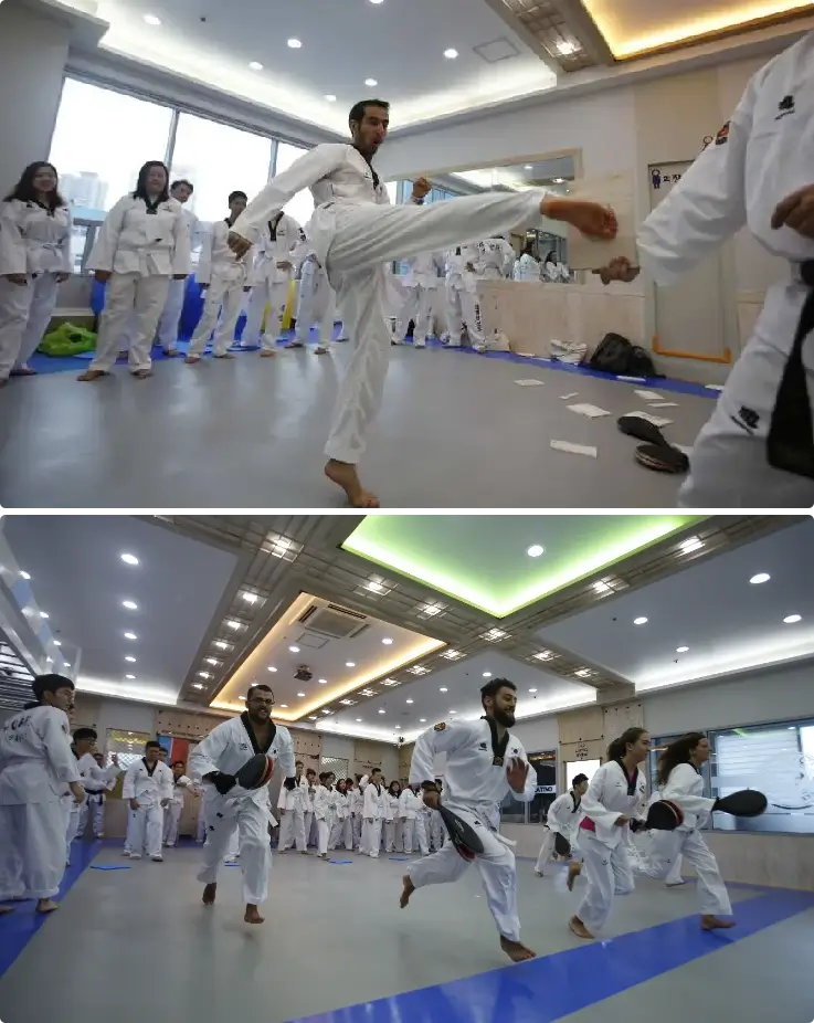 Participants practicing Taekwondo techniques including kicking and breaking boards in Busan