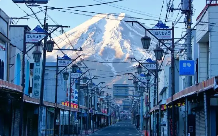Traditional street view with Hikawa Clock Shop and Mount Fuji in the background