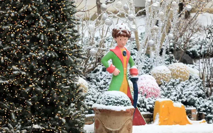 The Little Prince statue covered in snow at Petite France in Korea